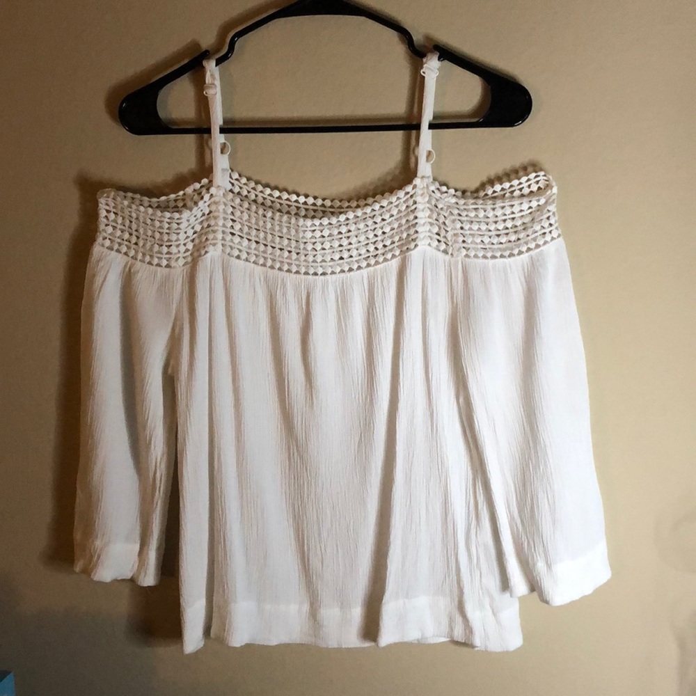 White off the shoulder blouse with straps.